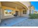 Inviting back patio with ceiling fan, bbq, and patterned brickwork, perfect for outdoor entertaining and relaxation at 9590 W Bajada Rd, Peoria, AZ 85383