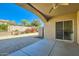 The outdoor area features a covered patio with a ceiling fan and sliding glass door leading to the interior at 9590 W Bajada Rd, Peoria, AZ 85383