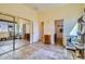 Bright flex room with mirrored closet doors, tile floor, and a view of the bathroom at 9590 W Bajada Rd, Peoria, AZ 85383