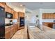 Kitchen island with granite countertops and a sink with custom cabinets and modern appliances at 9590 W Bajada Rd, Peoria, AZ 85383