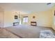 Spacious living room with neutral walls, carpeted floors, and natural light from a large window at 9590 W Bajada Rd, Peoria, AZ 85383