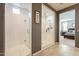 Luxurious bathroom with a glass-enclosed shower and view to the main bedroom at 9937 E Harvest Rd, Florence, AZ 85132