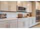 Modern kitchen featuring stainless steel appliances and sleek white countertops at 9937 E Harvest Rd, Florence, AZ 85132