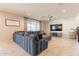 Cozy living room with a comfortable sectional sofa and a view of the backyard at 9937 E Harvest Rd, Florence, AZ 85132