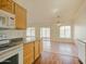 Well-lit kitchen with a view to the backyard and featuring updated appliances and cabinetry at 1052 W Paseo Way, Tempe, AZ 85283