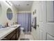 Bright bathroom with dual sinks, white countertops, and neutral finishes at 11538 W Laurelwood Ln, Avondale, AZ 85392