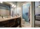 Stylish bathroom with dual sinks, white countertops, and modern fixtures at 11538 W Laurelwood Ln, Avondale, AZ 85392