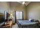 Serene bedroom featuring a comfortable bed and a view of the outside at 11538 W Laurelwood Ln, Avondale, AZ 85392