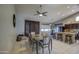 Open-concept dining room area with backyard views and bar seating at the kitchen island at 11538 W Laurelwood Ln, Avondale, AZ 85392