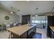 Kitchen island features granite countertop, stainless steel dishwasher, and sink with views into the dining area at 11538 W Laurelwood Ln, Avondale, AZ 85392