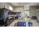Spacious kitchen features granite countertops, stainless steel appliances, and dark brown cabinetry at 11538 W Laurelwood Ln, Avondale, AZ 85392