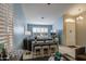 Living room boasts blue walls, recessed lighting, a front door view, a table with seating, and a leather sofa at 11538 W Laurelwood Ln, Avondale, AZ 85392