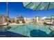 Beautiful pool with a serene waterfall feature, surrounded by ample patio space for lounging and entertaining at 11538 W Laurelwood Ln, Avondale, AZ 85392