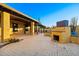 Outdoor space with a built-in fireplace and paved patio at 1235 E Clearview Dr, Casa Grande, AZ 85122