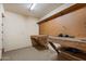 Basement with built-in wood workbench and pegboard backing provides space for tools, projects, and hobbies at 1235 E Clearview Dr, Casa Grande, AZ 85122