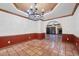 Dining area leading into the living room with tile floors and custom lighting at 1235 E Clearview Dr, Casa Grande, AZ 85122
