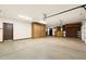 Spacious garage features built-in storage cabinets and high ceilings, offering ample space for vehicles and projects at 1235 E Clearview Dr, Casa Grande, AZ 85122