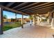 Large covered brick patio area ideal for outdoor entertaining and overlooking the backyard and pool at 1235 E Clearview Dr, Casa Grande, AZ 85122