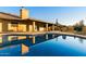 Backyard pool and patio area provides a relaxing and luxurious outdoor living space with a covered porch at 1235 E Clearview Dr, Casa Grande, AZ 85122