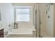Bright bathroom featuring a relaxing soaking tub and walk-in shower at 12901 W Wilshire Dr, Avondale, AZ 85392