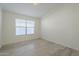 Empty bedroom featuring a neutral color palette, laminate floors and a window at 12901 W Wilshire Dr, Avondale, AZ 85392