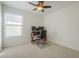 Serene bedroom equipped with a ceiling fan, providing a comfortable workspace at 12901 W Wilshire Dr, Avondale, AZ 85392