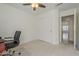 Neutral bedroom with a black chair and a closet at 12901 W Wilshire Dr, Avondale, AZ 85392