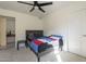 Bedroom featuring a ceiling fan and access to an additional room, offering versatility at 12901 W Wilshire Dr, Avondale, AZ 85392