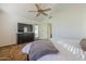 Relaxing main bedroom features ceiling fan, backyard access, and closet at 12901 W Wilshire Dr, Avondale, AZ 85392