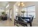 Dining area with stylish table and chairs under an elegant chandelier at 12901 W Wilshire Dr, Avondale, AZ 85392