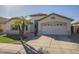 Single-Gathering home with desert landscaping, a two-car garage, and an inviting entrance at 12901 W Wilshire Dr, Avondale, AZ 85392