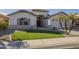 Beautiful single-story home with green lawn, desert landscaping, and inviting curb appeal at 12901 W Wilshire Dr, Avondale, AZ 85392