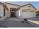 Attractive home featuring a double-door entrance, a two-car garage, and desert landscaping at 12901 W Wilshire Dr, Avondale, AZ 85392