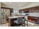 Modern kitchen with stainless steel appliances, center island and stylish seating at 12901 W Wilshire Dr, Avondale, AZ 85392