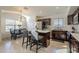 Bright kitchen featuring a center island with seating, stainless steel appliances, and a dining area at 12901 W Wilshire Dr, Avondale, AZ 85392