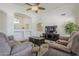 Spacious living area with a television, comfortable seating, and stylish decor at 12901 W Wilshire Dr, Avondale, AZ 85392