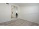 Open-concept living room featuring stylish tile floors and archway to other rooms at 12901 W Wilshire Dr, Avondale, AZ 85392