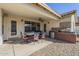 Covered patio area with a large table and outdoor kitchen at 12901 W Wilshire Dr, Avondale, AZ 85392