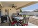 A patio with a dining table and outdoor kitchen area at 12901 W Wilshire Dr, Avondale, AZ 85392