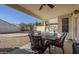 Outdoor patio with a table, chairs and a swimming pool in the background at 12901 W Wilshire Dr, Avondale, AZ 85392