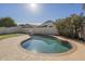 Backyard pool with a basketball hoop at 12901 W Wilshire Dr, Avondale, AZ 85392
