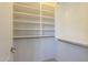 Well-organized walk-in closet with ample shelving and rod space for storage at 12901 W Wilshire Dr, Avondale, AZ 85392
