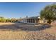 Home featuring a backyard with gravel and rock creating a low maintenance outdoor space at 12946 W Maplewood Dr, Sun City West, AZ 85375