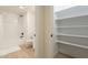 Bathroom with shower and built-in shelves at 12946 W Maplewood Dr, Sun City West, AZ 85375