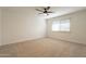 Neutral bedroom with carpet and a window at 12946 W Maplewood Dr, Sun City West, AZ 85375