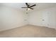 Spacious bedroom with carpet, ceiling fan, and neutral decor at 12946 W Maplewood Dr, Sun City West, AZ 85375