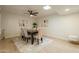 Elegant dining room includes a modern ceiling fan, wood flooring, and stylish decor at 12946 W Maplewood Dr, Sun City West, AZ 85375