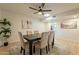 Comfortable dining room with a modern table setting and stylish decor elements at 12946 W Maplewood Dr, Sun City West, AZ 85375
