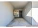 The covered entryway with a security screen door leads to a bright foyer at 12946 W Maplewood Dr, Sun City West, AZ 85375