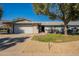 Charming single-story home with a two car garage and beautiful drought tolerant landscaping at 12946 W Maplewood Dr, Sun City West, AZ 85375